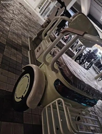 Трёхколёсный скутер